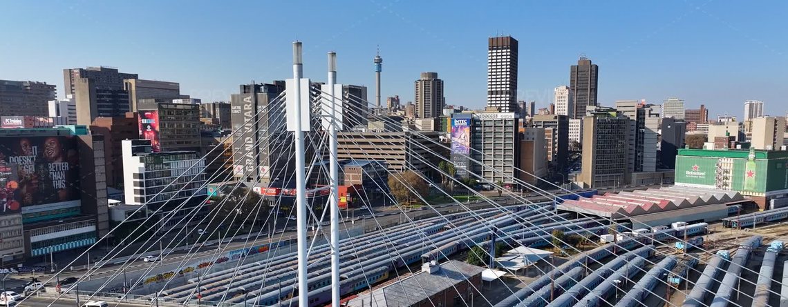 Nelson Mandela Bridge and Johannesburg skyline — rent to own cars in Johannesburg